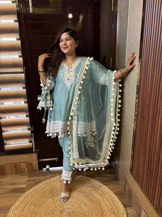 Pompom designer suits with potli