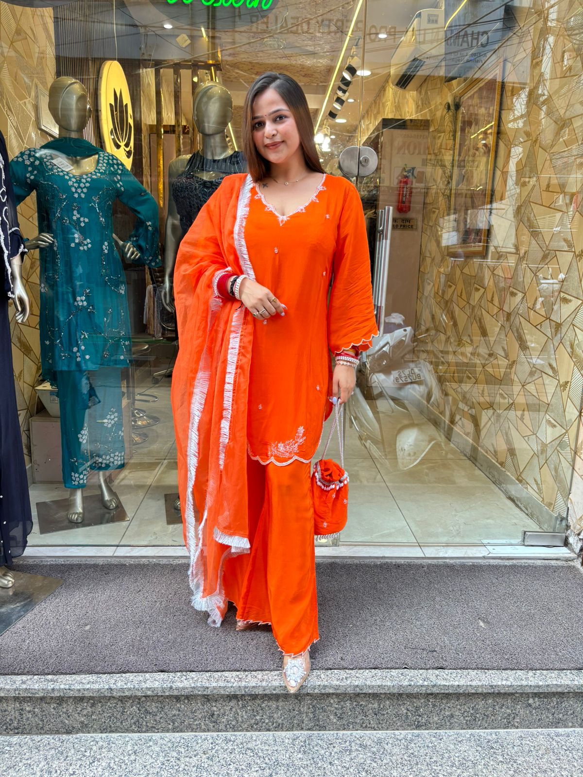 Orange Tangy Suit with Potli