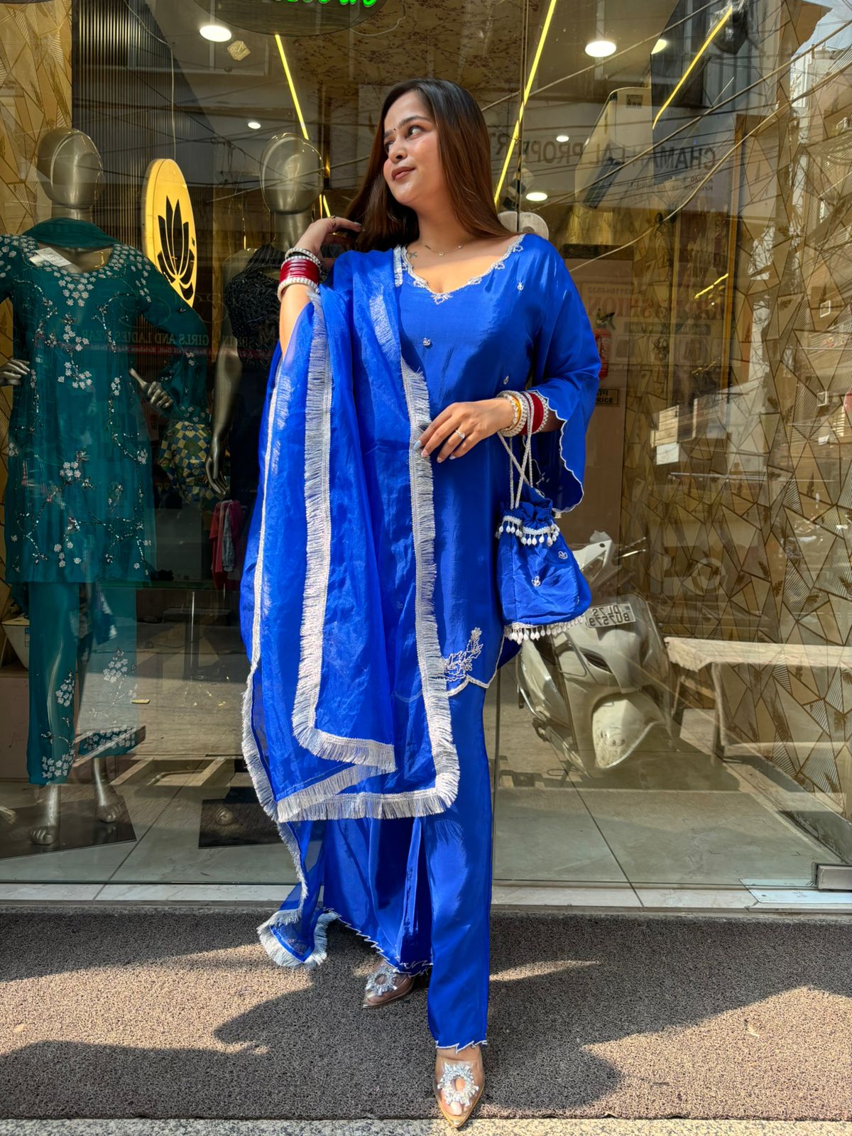 Blue Tangy Suit with Potli