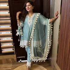 Pompom designer suits with potli